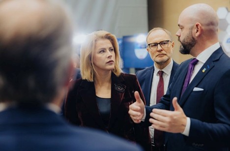 Latvia Prime Minister Evika Siliņa (left) and Latvia Minister of Defence Andris Sprūds (middle) discussed U.S. DiBaX contributions with Principal Director FutureG Dr. Tom Rondeau (right)