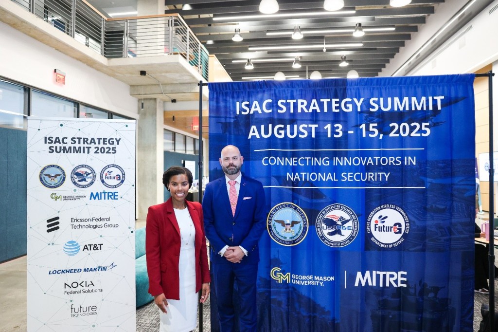 Federal Communications Commission Commissioner Olivia Trusty (left) and Principal Director for FutureG Dr. Tom Rondeau (right) at the ISAC Strategy Summit on August 13, 2026.